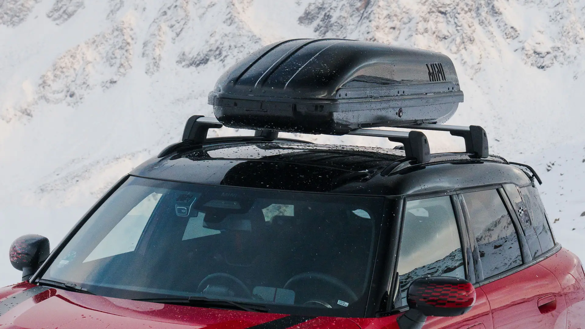 MINI Countryman in Chili Red II with MINI Roof Box 320 in Black.