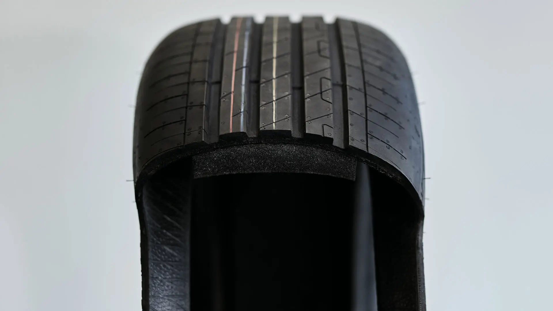MINI-approved tyre with a layer of foam on the inner surface that absorbs the noise produced by vibrations within the cavity.